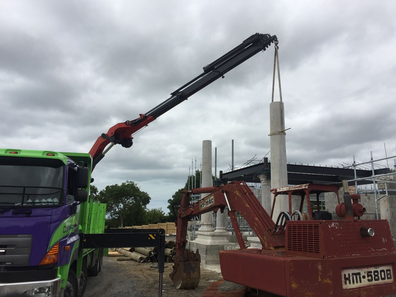Lifting plant alongside a structure.