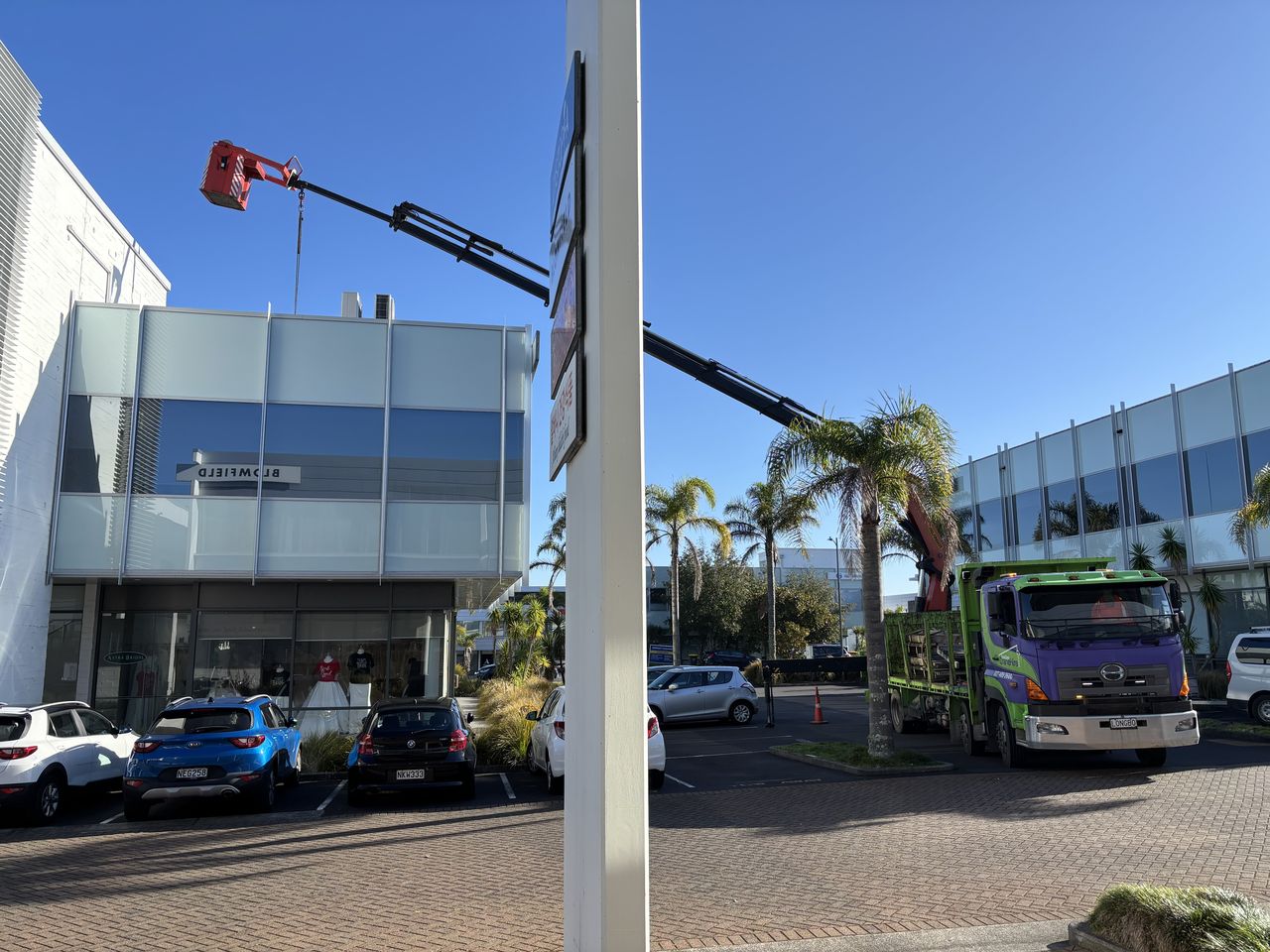 Working alongside a commercial building.