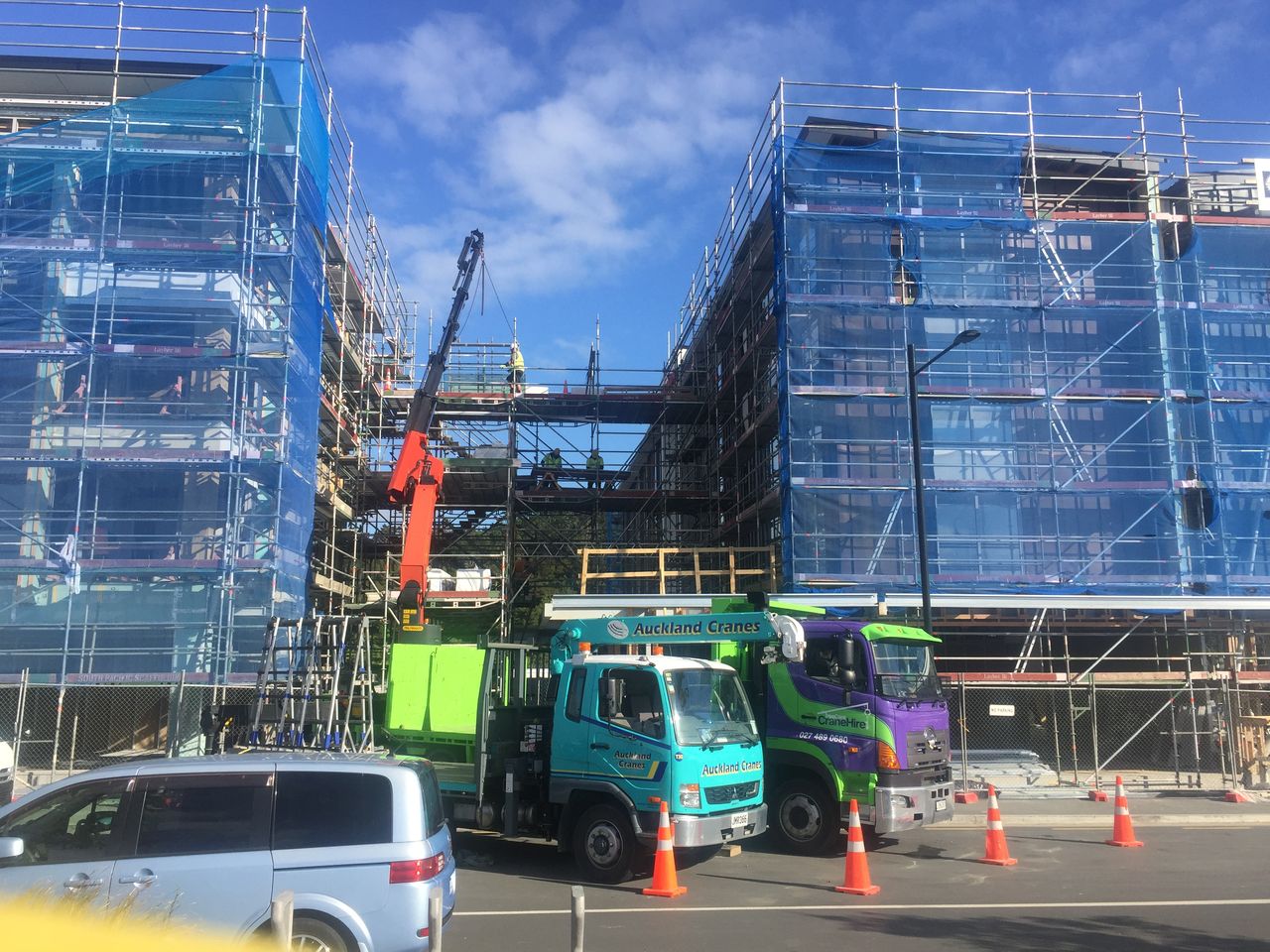 Delivering to a scaffolded street frontage.