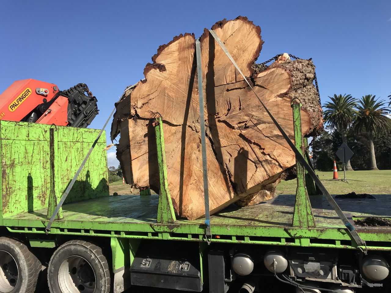 Large rounds strapped down for transport.