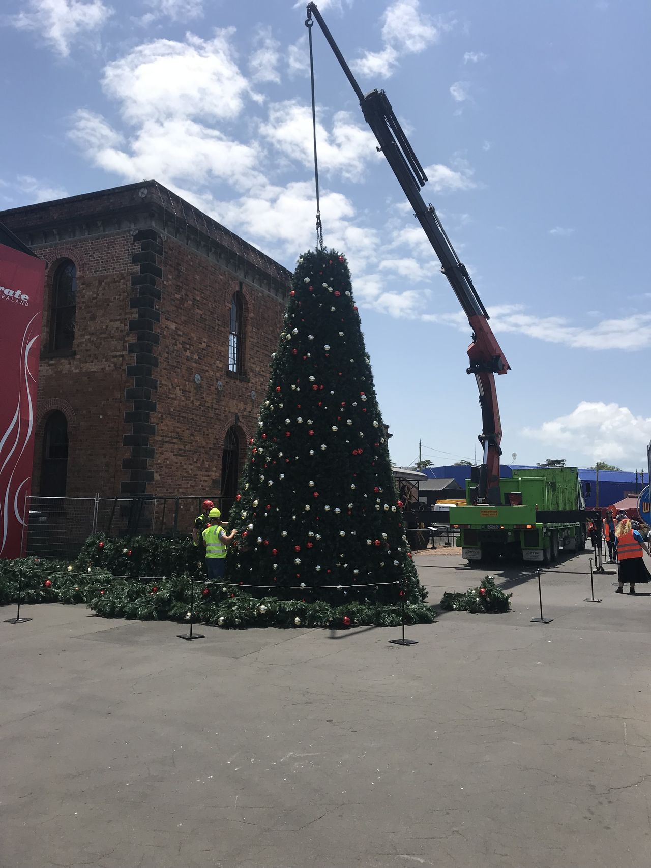 Standing a large Christmas tree.